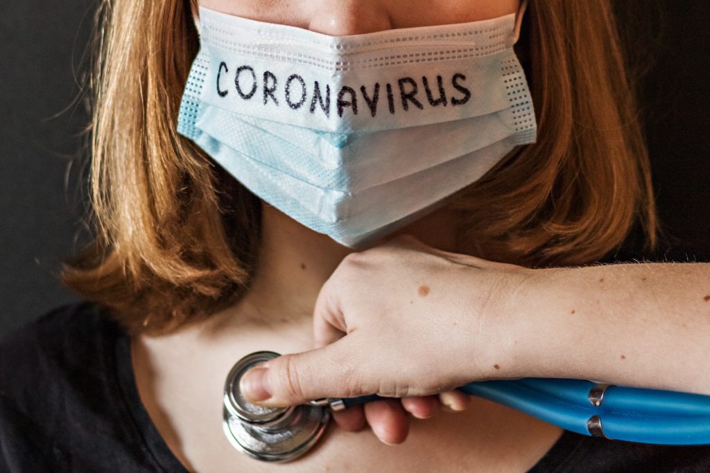 a close up portrait of a girl in an icy mask on her face with suspected coronavirus which the doctor t XvRgWG