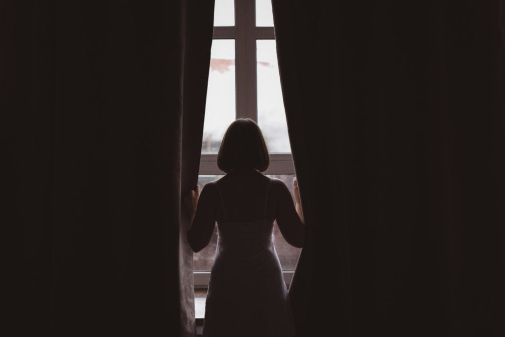 the girl at the window alone hand holding stretching young beauty joy comfortable view up curtains t kRdvRX